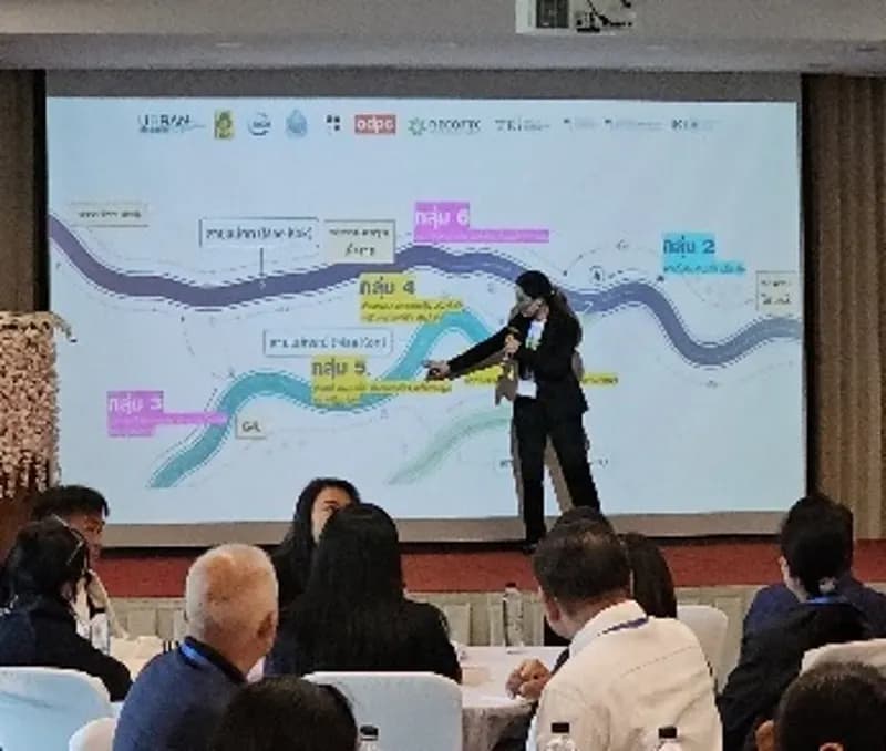 A facilitator presenting a river flood map to the Chiang Rai workshop audience